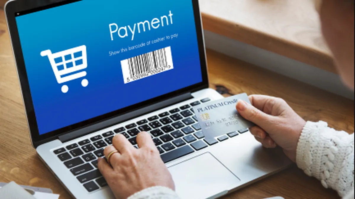 Guest completing an online hotel booking and payment on a laptop